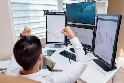 Successful day trader celebrating profits